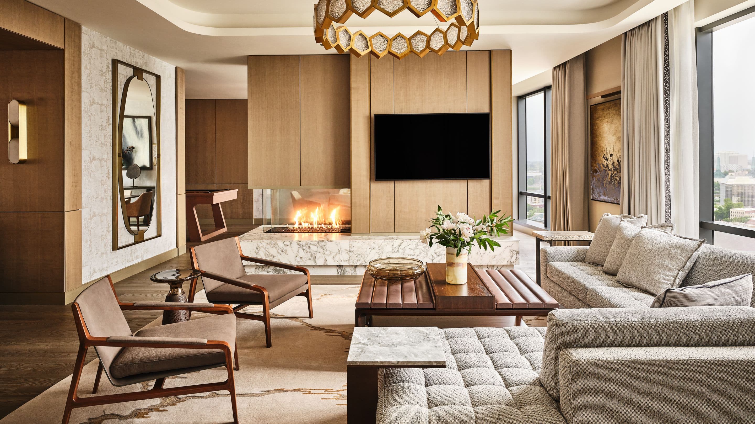 Ritz-Carlton suite living room with fireplace and city views